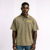 Man wearing a green polo shirt with 'Rascal Rogue' logo on a white background